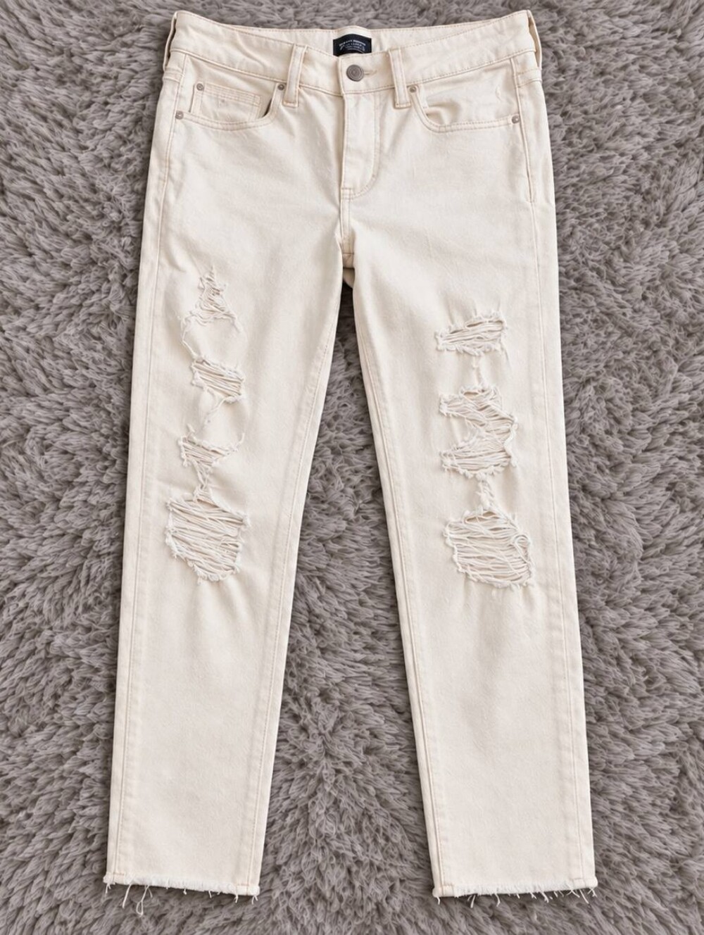 American Eagle Outfitters Cream Skinny Distressed Jeans